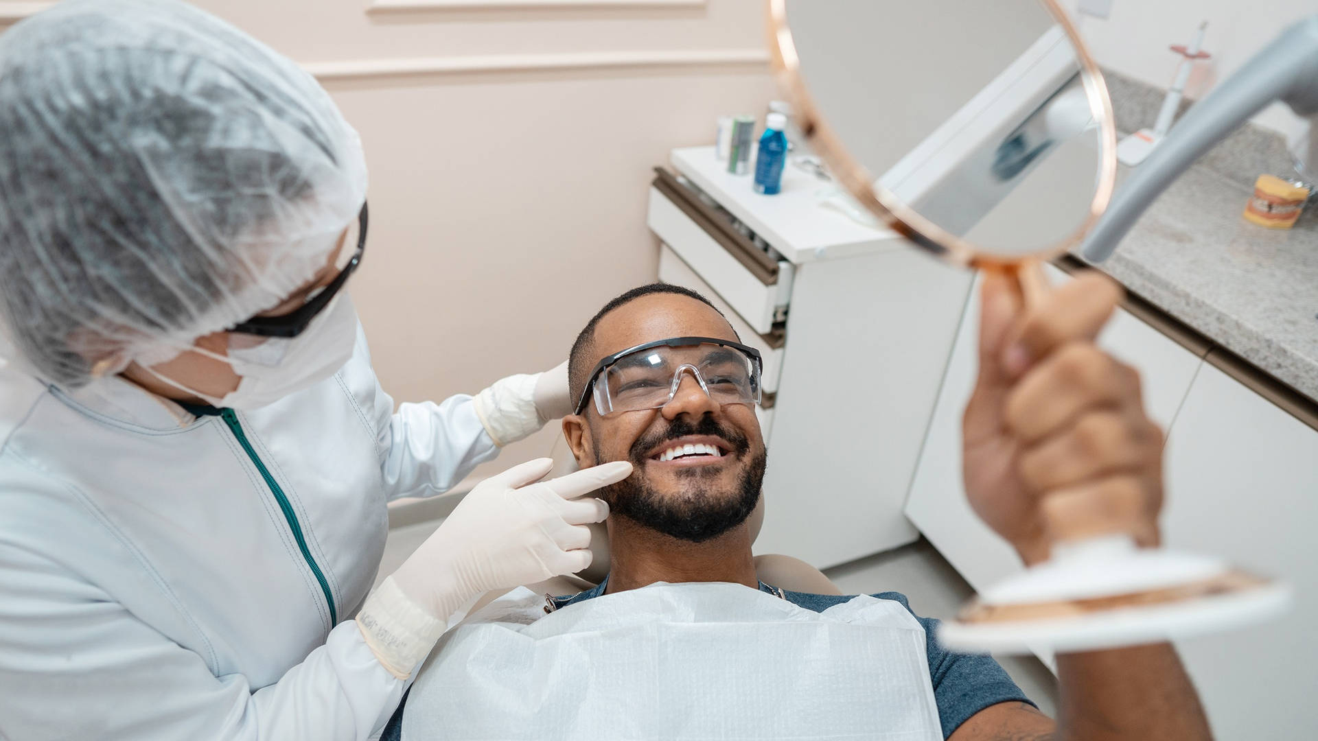 Dentist Near Me in London, Ontario | Reliable Local Dental Clinic 8 Dentist examining a patient during a routine checkup in London, Ontario